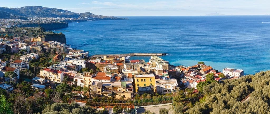 A captivating view of Sorrento, Italy, showcasing its stunning coastal landscape, vibrant architecture, and azure waters along the Amalfi Coast. 