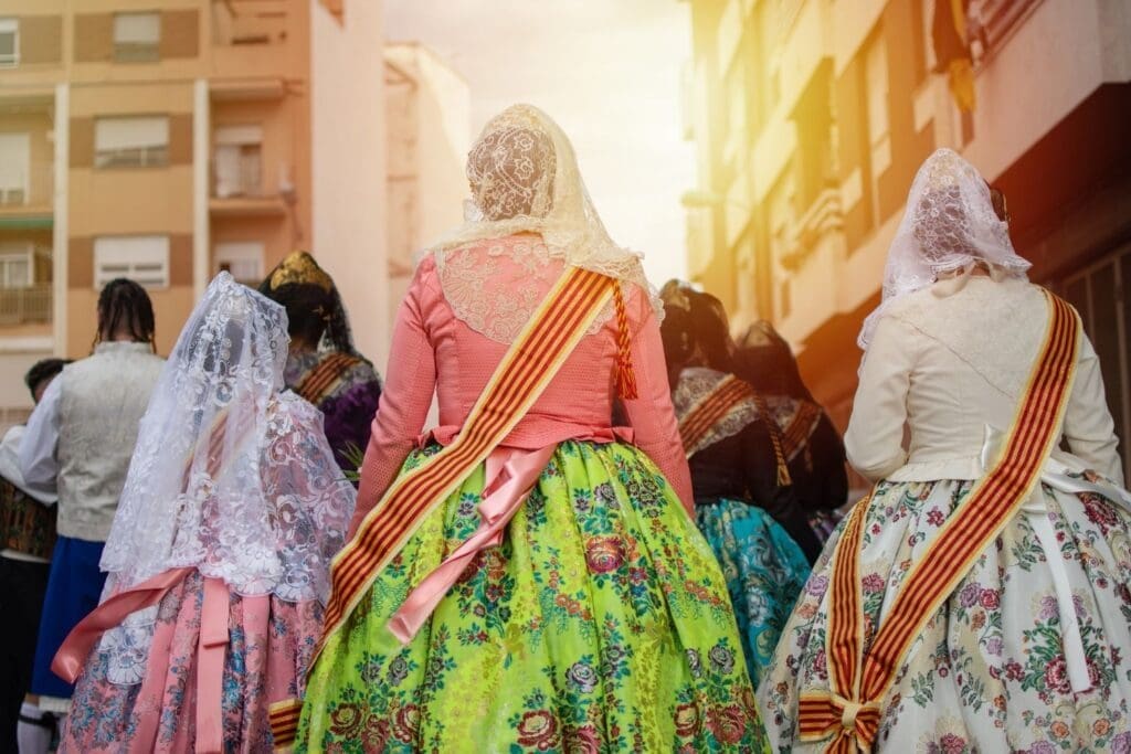 A group of Falleras women with colorful dresses
