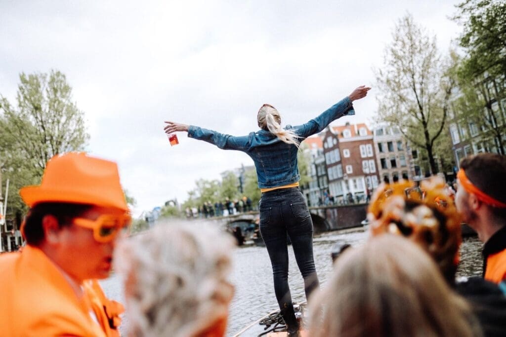 A young woman is celebrating the King's Day in Amsterdam