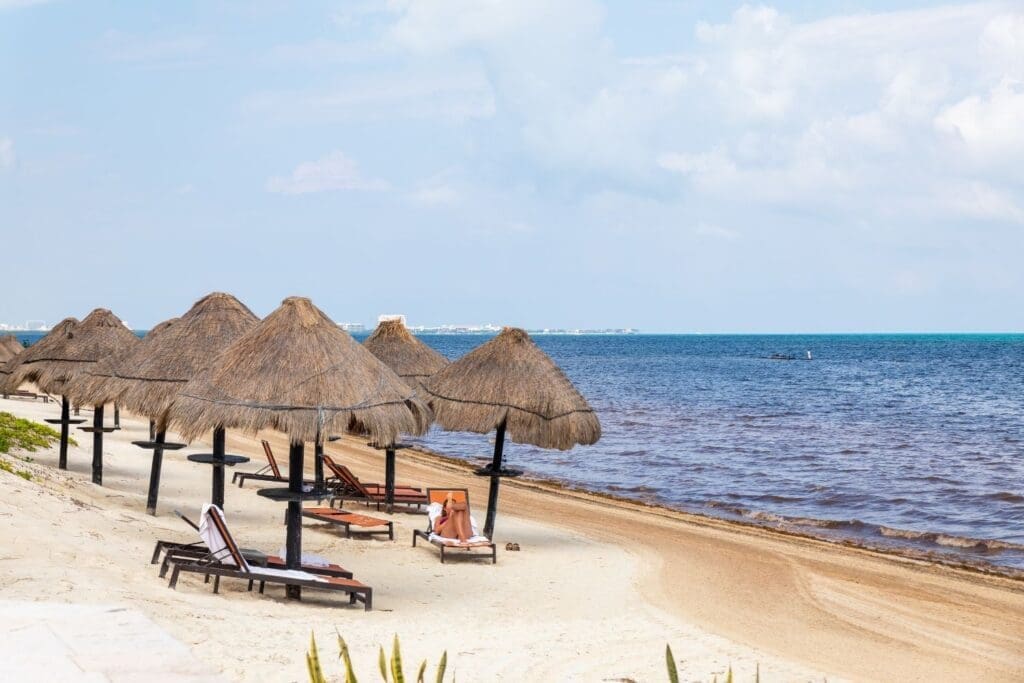 Grass umbrellas in front of Moon Palace resorts, Cancun